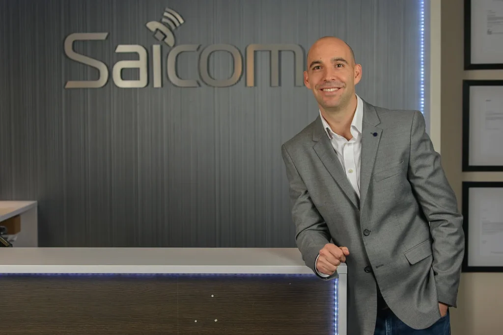 Man, professional smile, in the workplace