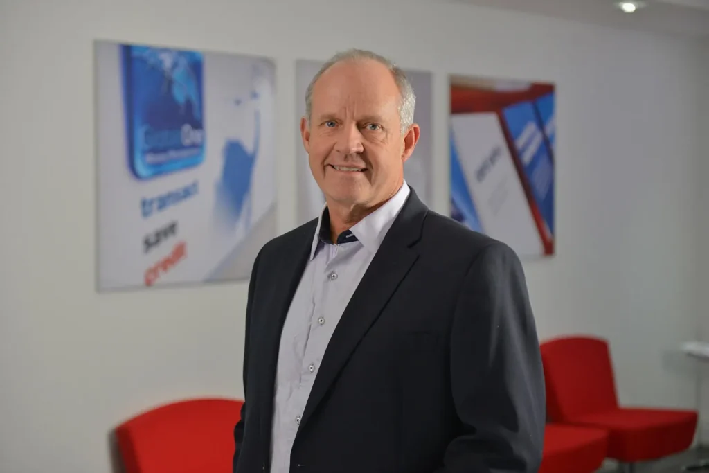 Man, professional smile, in the workplace — Cape Town
