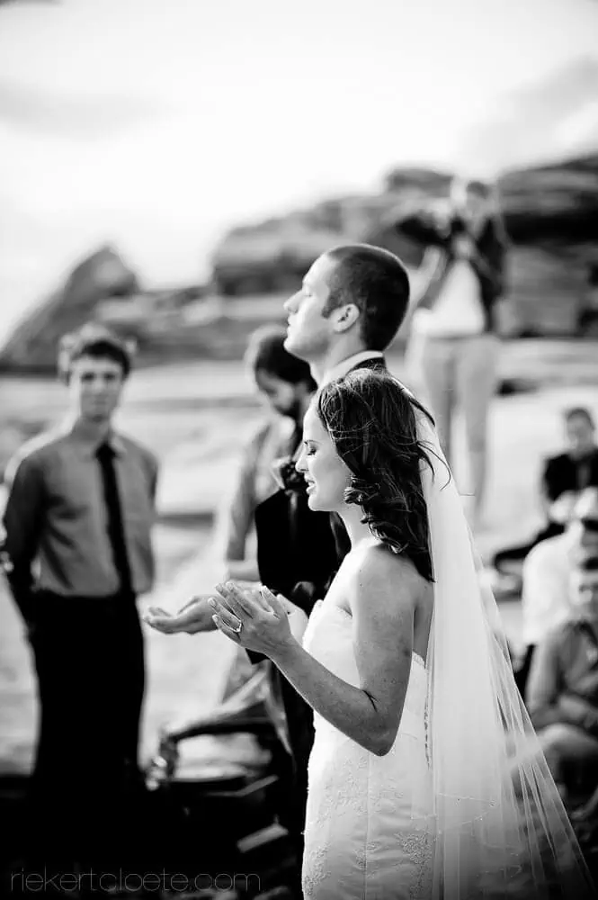 hermanus wedding bride praying hands coastal ceremony