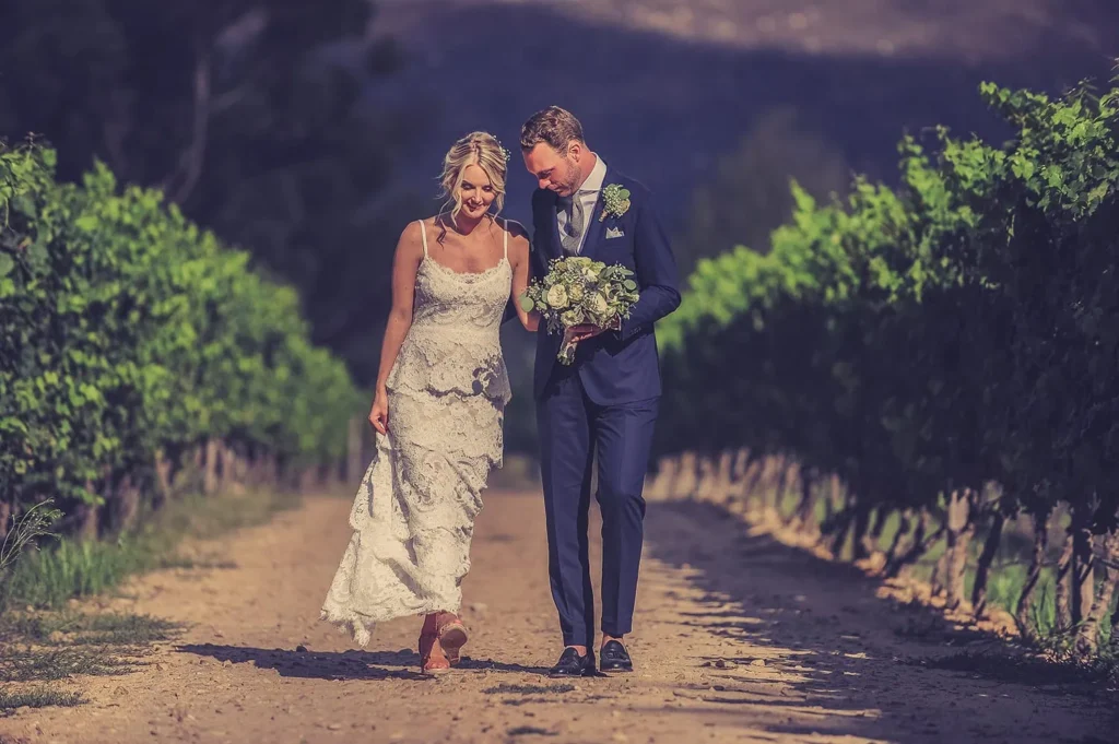 holden manz wedding couple vineyard walk