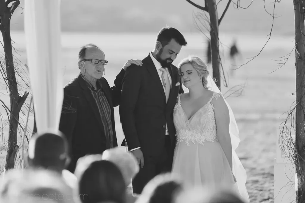 outdoor coastal ceremony prayer officiant blessing