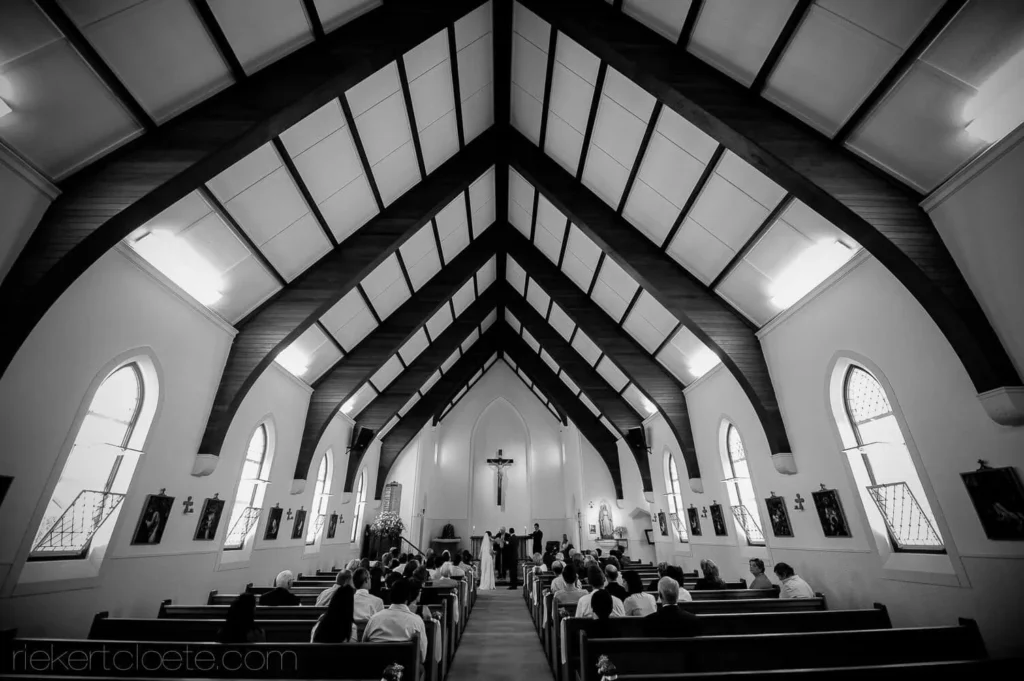traditional church ceremony arched ceiling couple vows