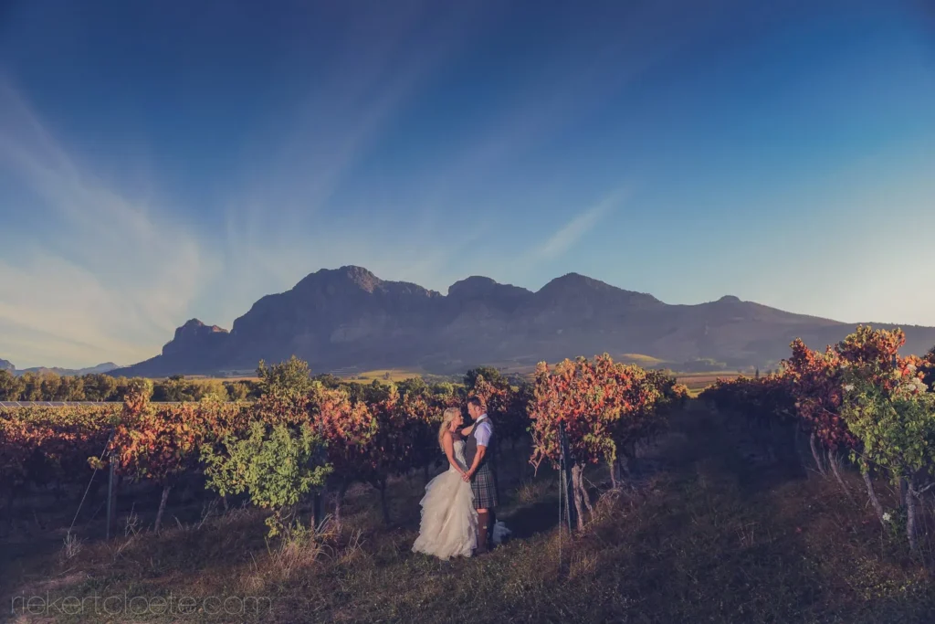 vineyard couple autumn foliage mountain dramatic sky