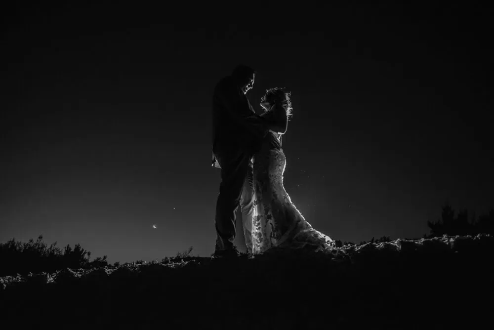 wedding couple embrace starry night black white