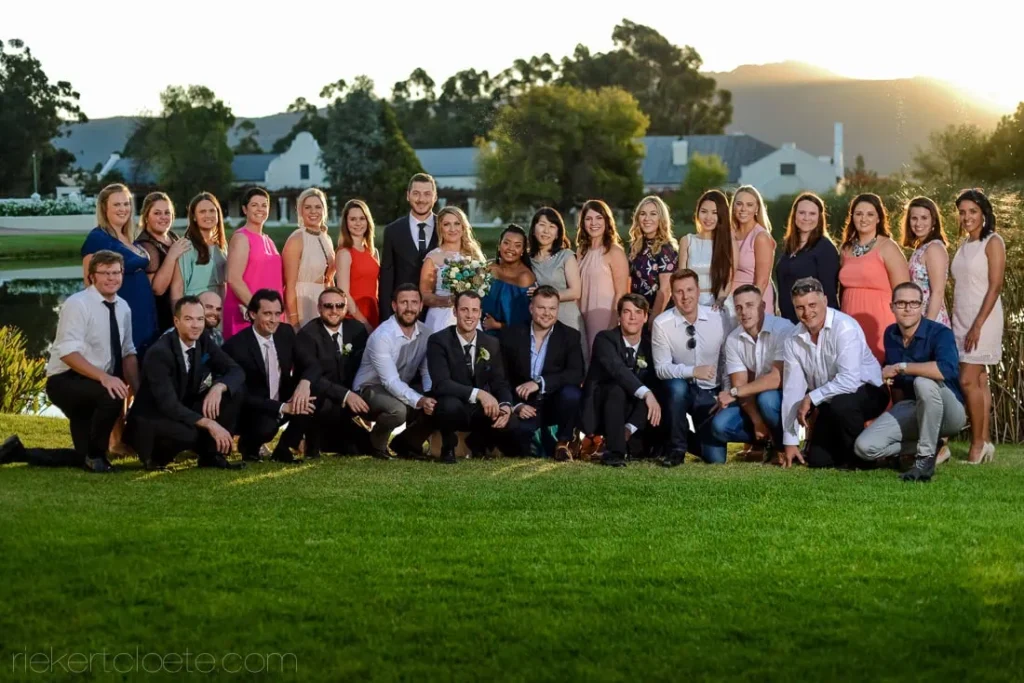 wedding group golden hour wine estate lawn