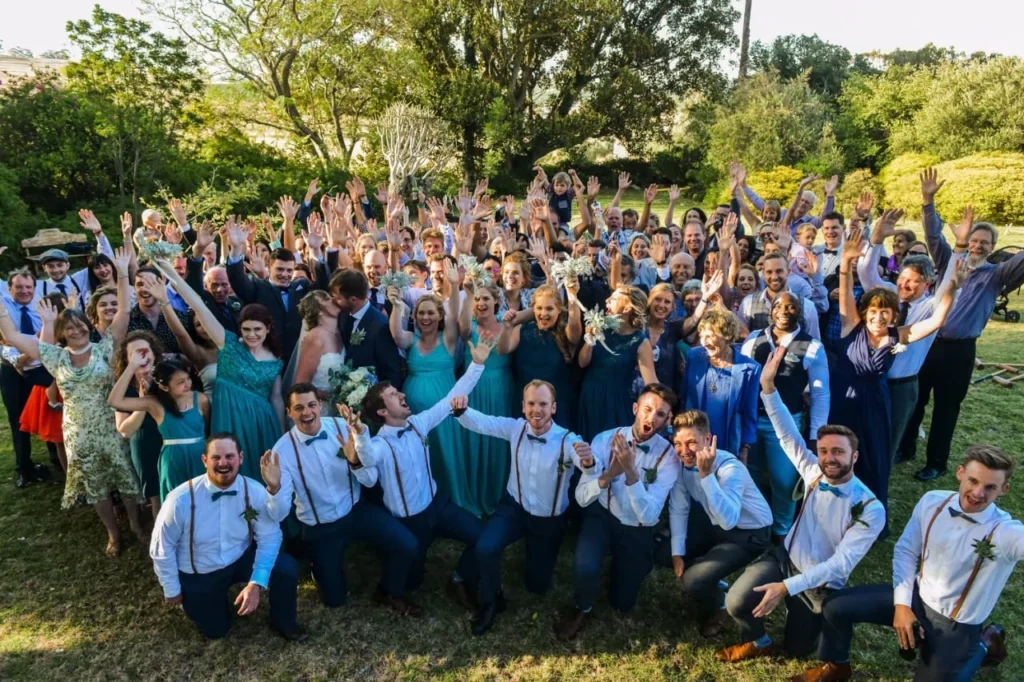 wedding group photo grassy garden celebration
