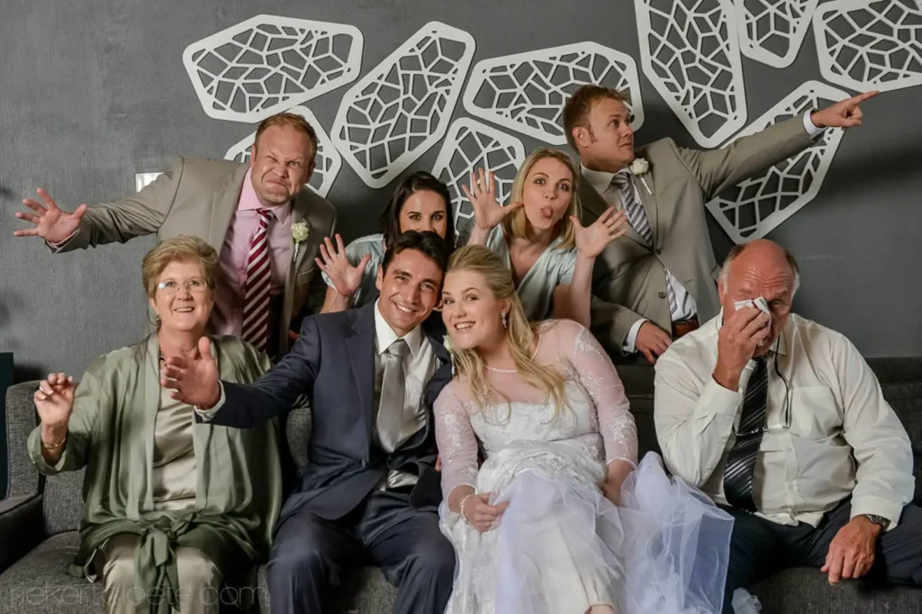 wedding party playful group photo modern venue