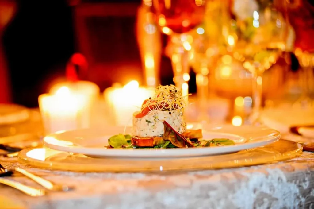 wedding reception goat cheese starter candlelit gold charger