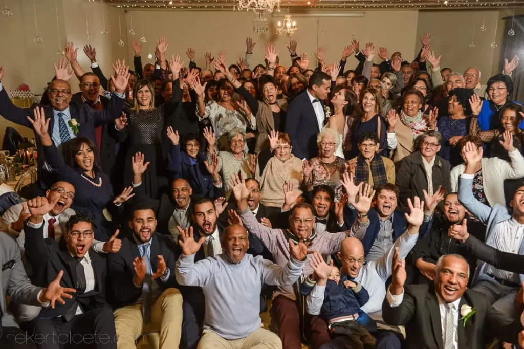 wedding reception group cheering indoor ballroom