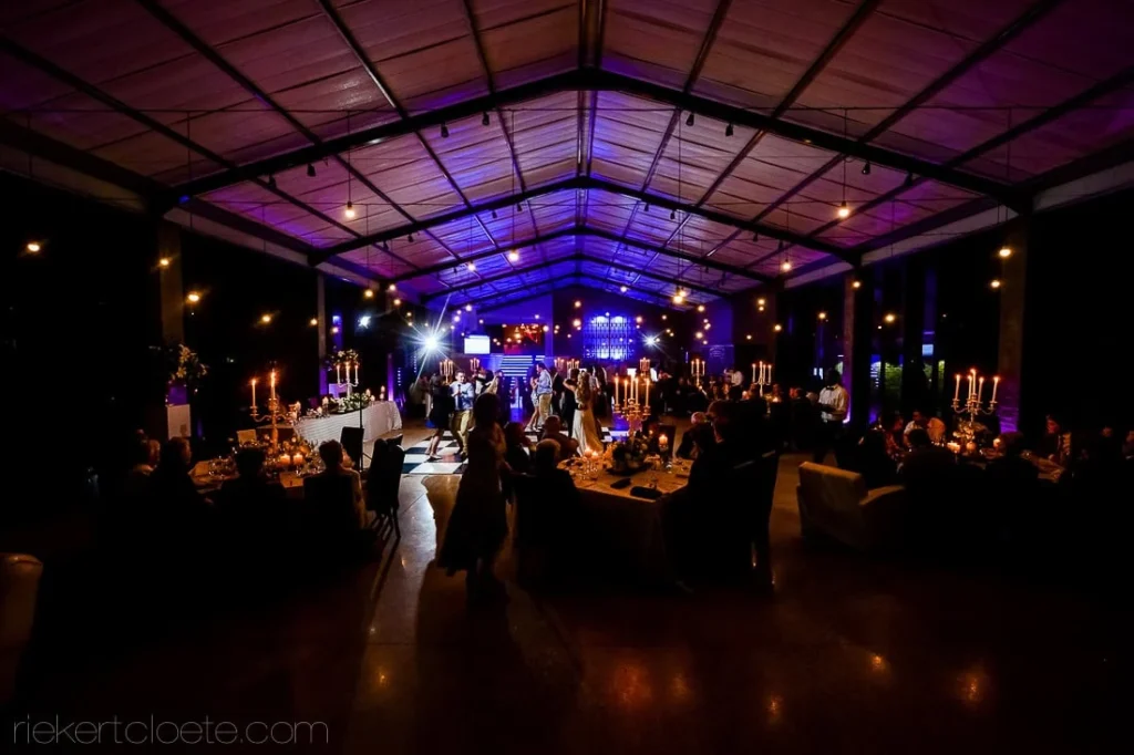 wide shot marquee reception blue lighting candelabras