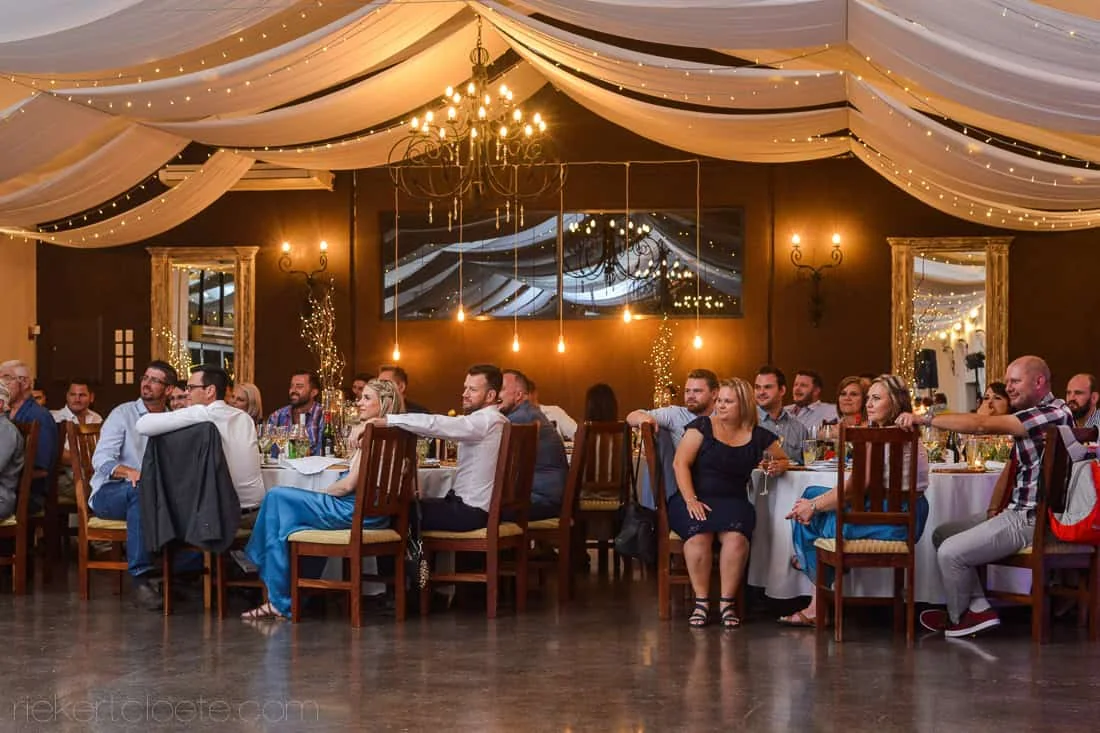 Wedding reception guests rustic venue warm lighting – Allesverloren, Riebeek Valley & Swartland