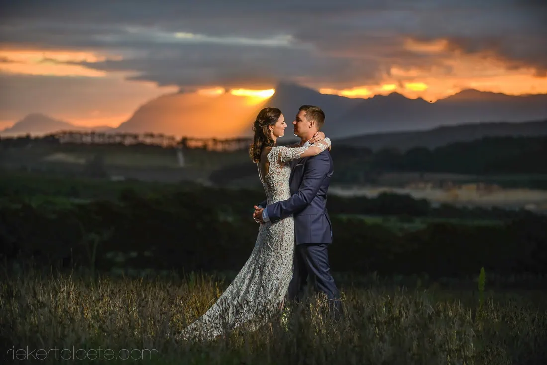 Couple dancing green grasslands stormy sunset – Bona Dea Estate, Hermanus