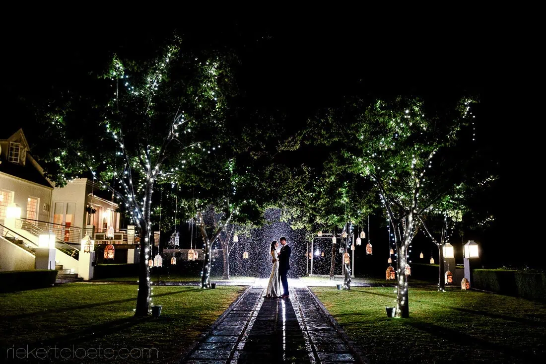 Couple dancing lantern path fairy lights night – Bona Dea Estate, Hermanus