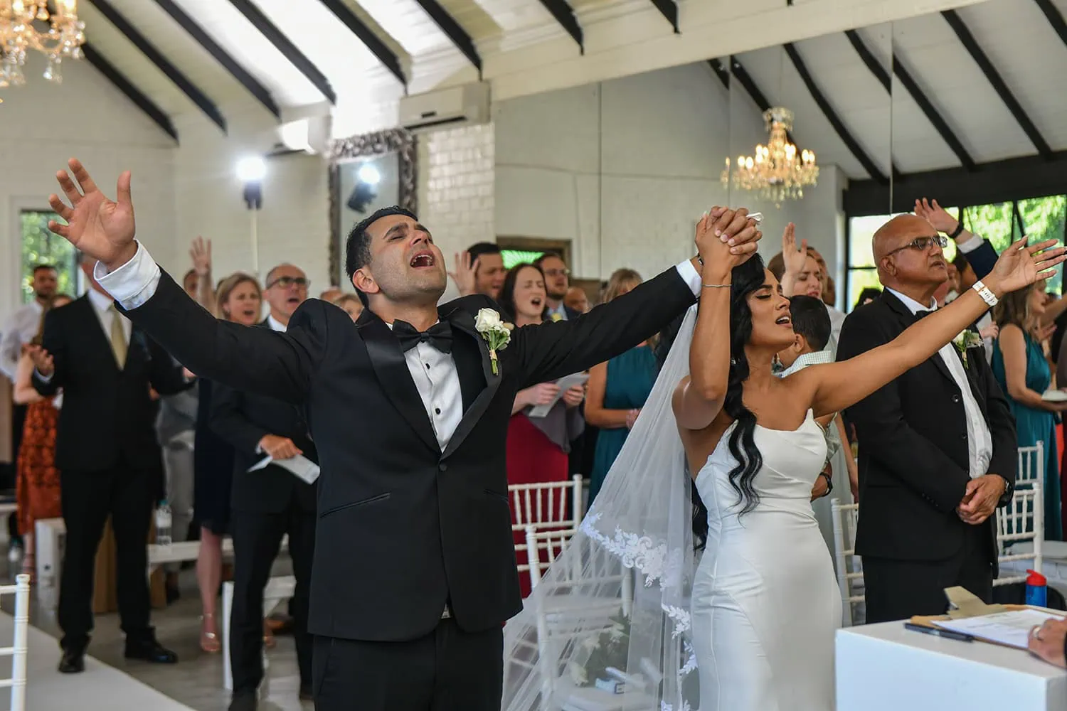 Brenaissance wedding worship hands raised ceremony – Brenaissance Wine Estate, Stellenbosch