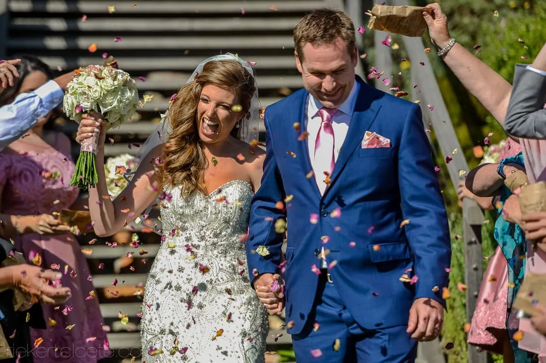 Groom royal blue suit colorful confetti ceremony – Cape Point Vineyards, Cape Town