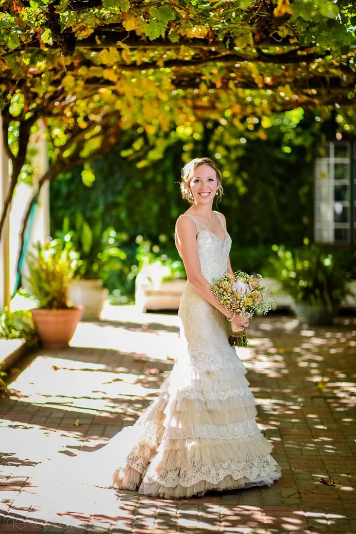 Groenkloofbride tiered lace gown autumn courtyard garden – Groenrivier Function Centre, Riebeek Valley & Swartland