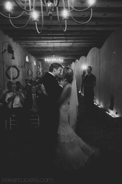 Groenvlei wedding couple first kiss chandelier hall – Groenrivier Function Centre, Riebeek Valley & Swartland
