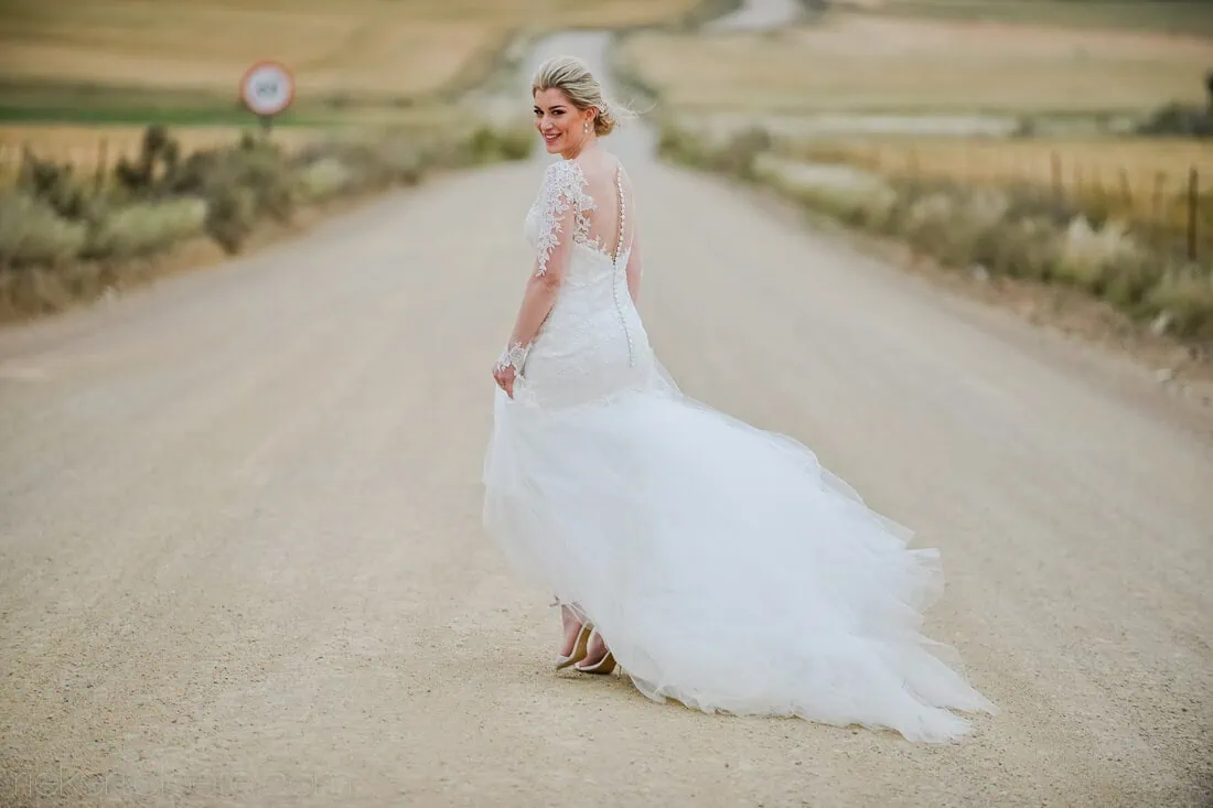 Bride lace gown dirt road wheat fields – Het Vlock Casteel, Riebeek Valley & Swartland