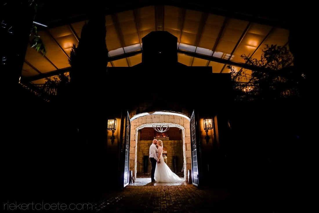 Couple silhouette stone arch gateway nightshot – Het Vlock Casteel, Riebeek Valley & Swartland