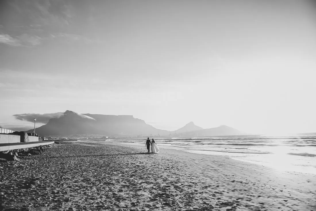 Couple beach table mountain cape town backdrop – Lagoon Beach Hotel, Cape Town