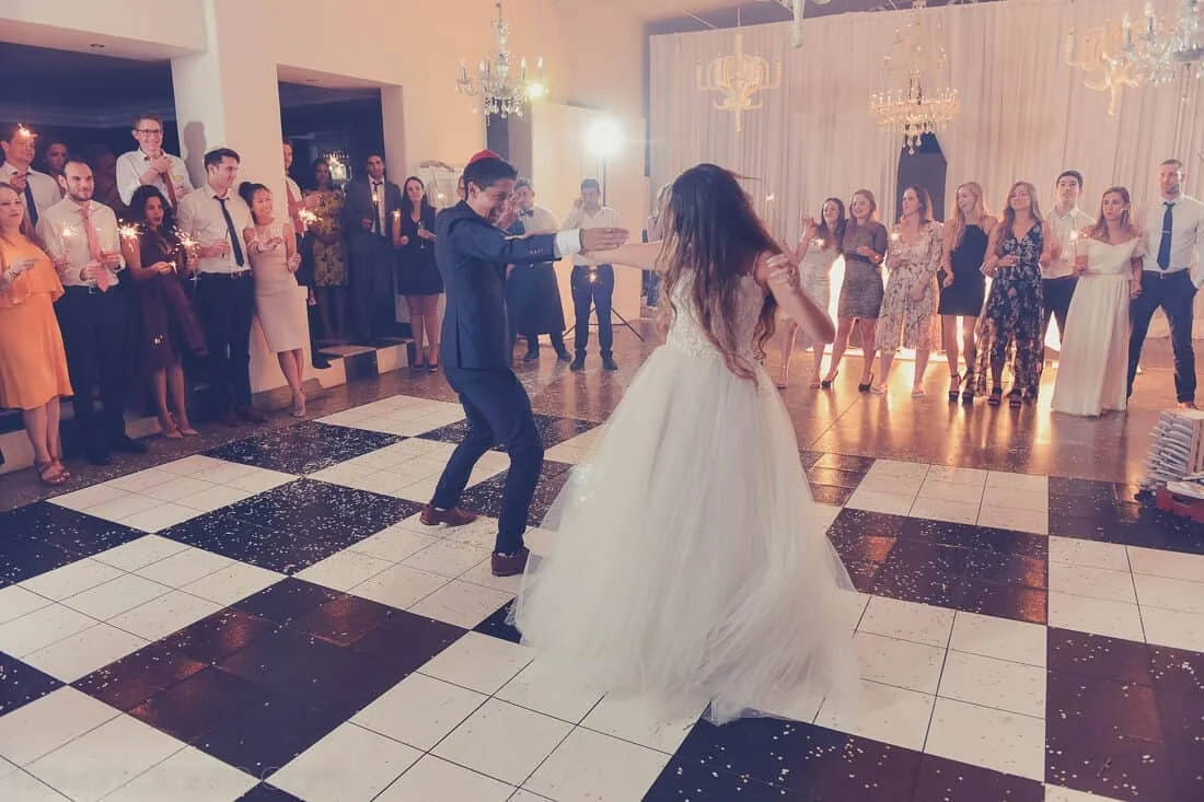 Couple energetic first dance checkered floor sparklers – MolenVliet Oosthuizen Family Vineyards, Stellenbosch