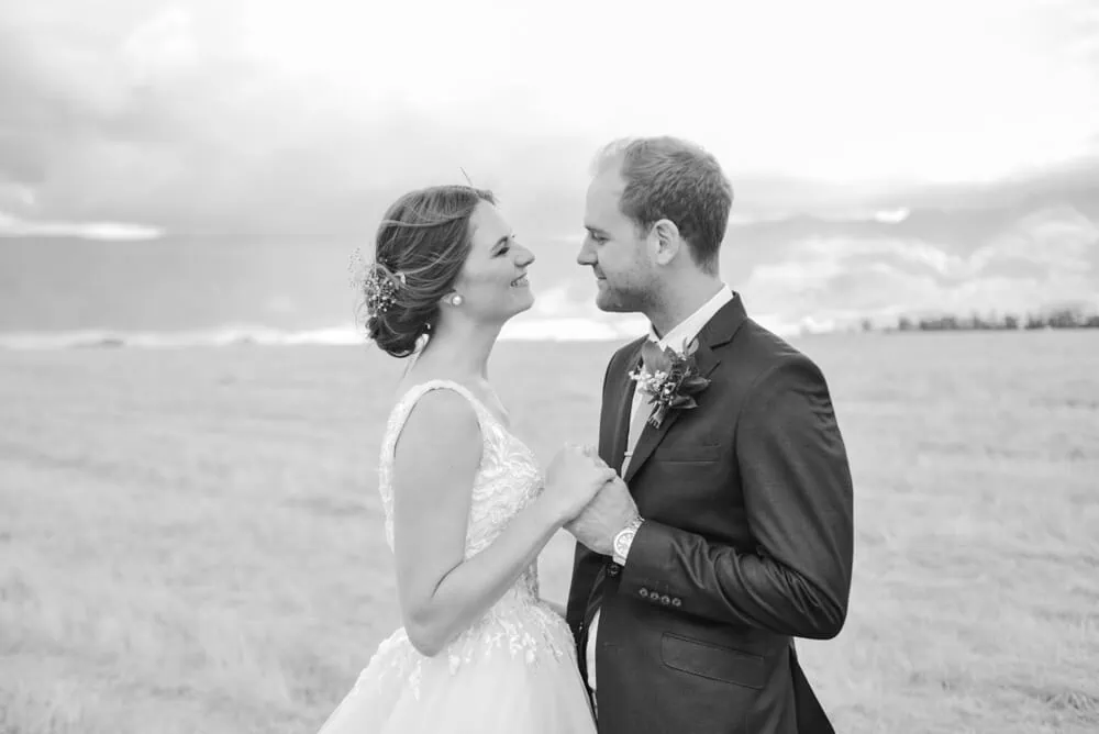 Bride groom facing stormy mountain backdrop portrait – Montpellier Wine Estate, Tulbagh