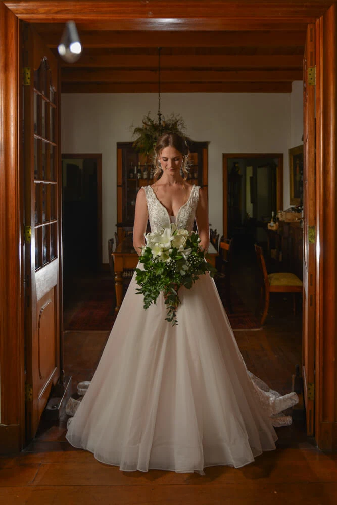 Bride v neck ballgown heritage home doorway bouquet – Montpellier Wine Estate, Tulbagh