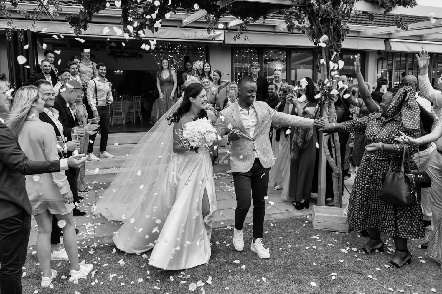 Bride groom confetti exit venue patio fairy lights – Suikerbossie, Cape Town