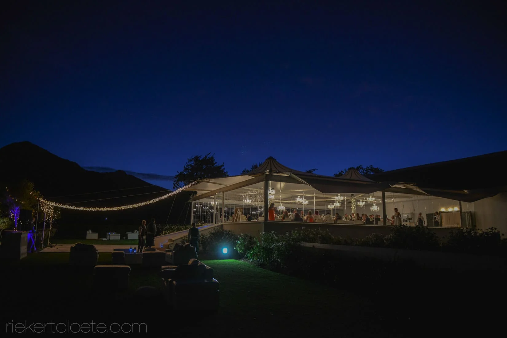 Wedding venue chandelier marquee mountains night exterior – Vrede en Lust Wine Estate, Franschhoek