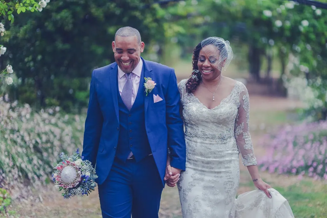 Couple walking garden lavender protea bouquet – Vredenheim, Stellenbosch