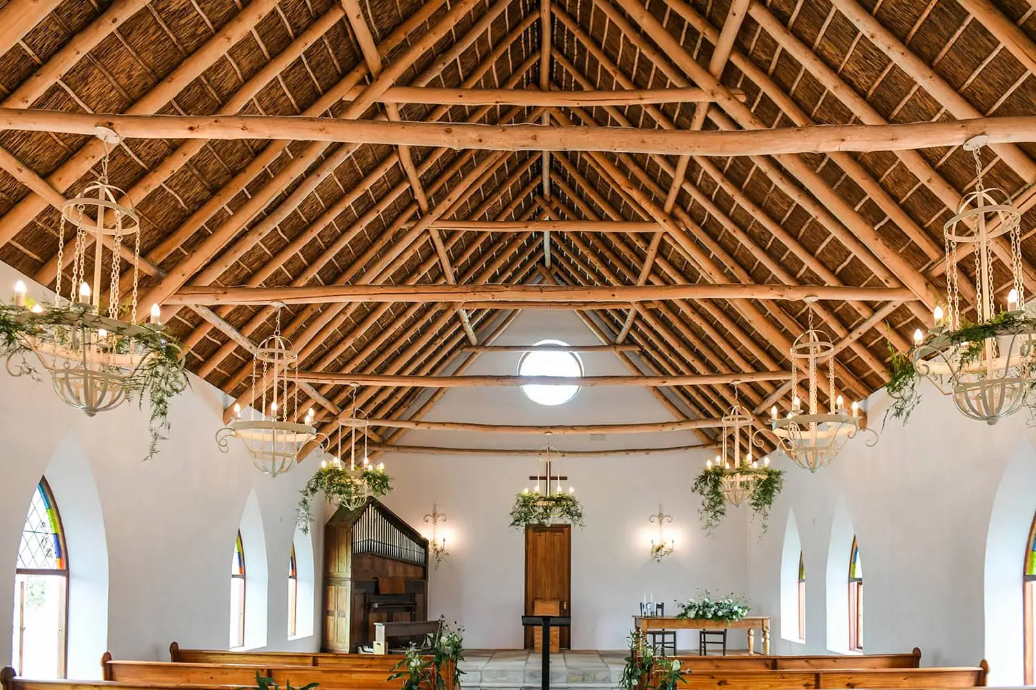 Chapel thatched roof wooden rafters hanging chandeliers – Zorgvliet Wine Estate, Stellenbosch