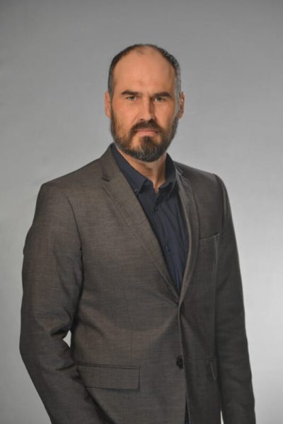 Man looking at camera while getting headshot done