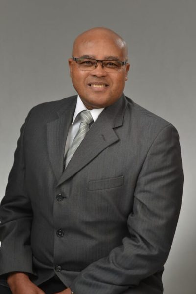 corporate Headshot of man with grey suit