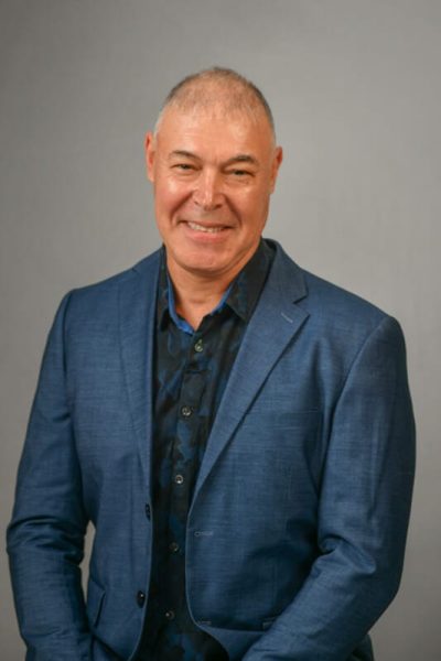 Man with jacket getting his headshot taken by corporate photographer in cape town